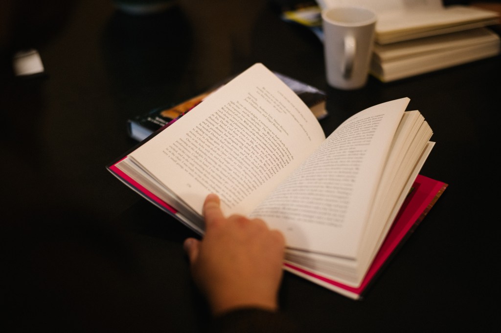 Person reading a book.