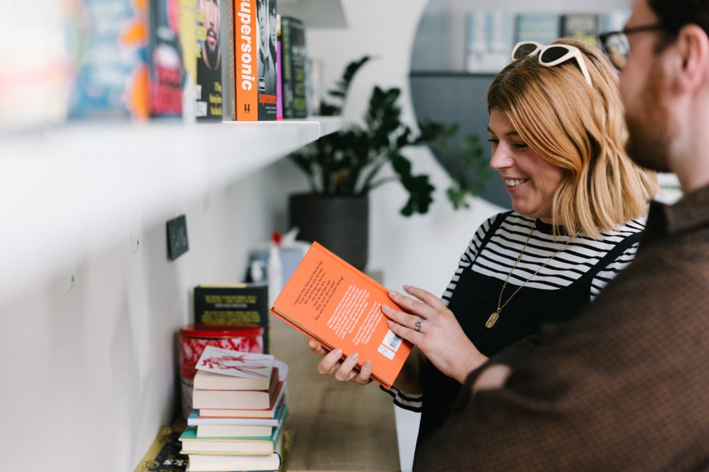 Colleagues browsing books.